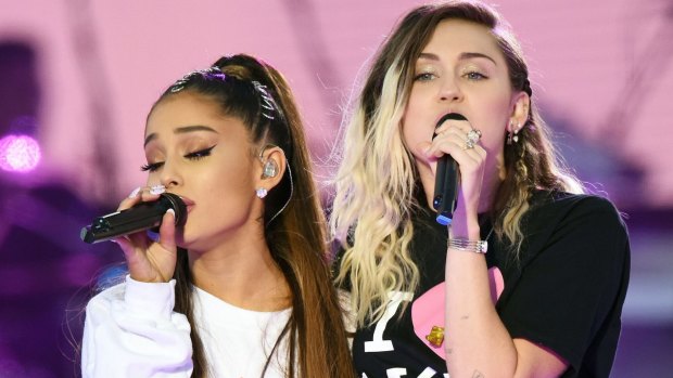 Ariana Grande and Miley Cyrus performing at the One Love Manchester concert.