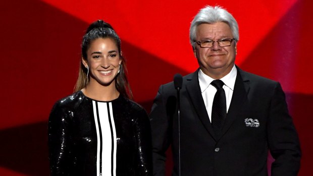 Gymnast Aly Raisman and former NHL player Marcel Dionne present onstage during the 2017 NHL Awards and Expansion Draft at T-Mobile Arena on June 21, 2017 in Las Vegas, Nevada.