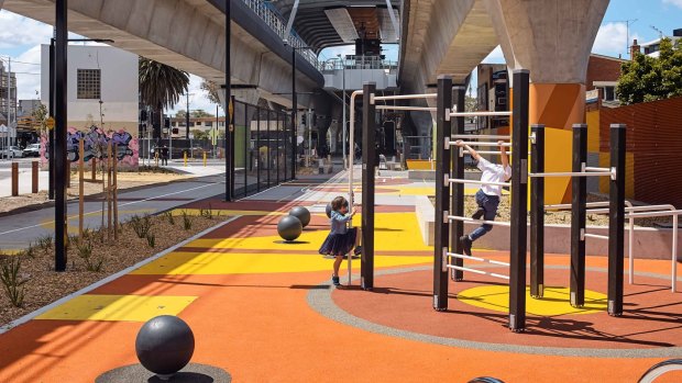 Designed by ASPECT Studios, a space under Skyrail entices children to its playground. 