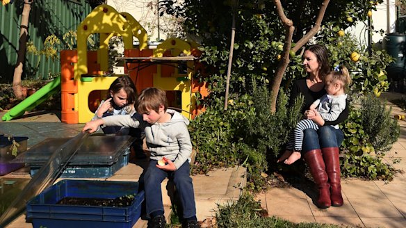 Elizabeth Slakey with her children (from left) Luca, 8, Declan, 5, and Pippi, 2: Valuations for the family's Haberfield home differ by nearly $350,000.