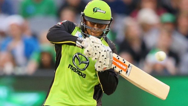 Green with envy: Usman Khawaja cuts for the Sydney Thunder.