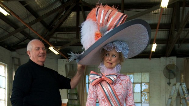 Designer Roger Kirk and singer Taryn Fiebig with the outfit that is estimated to fetch between $2000 and $4000.