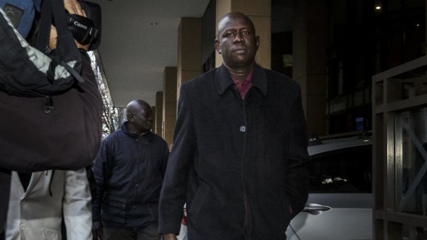 Joseph Tito Manyang, the father of the children, outside Melbourne Magistrates Court.