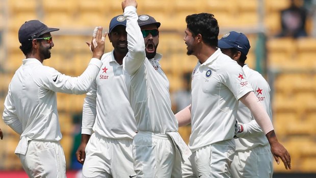 No love lost: India's captain Virat Kohli celebrates after the dismissal of Steve Smith.