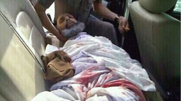 Sheikh Nimr lies wounded in the back of a Saudi police car on July 8, 2012, the day of his arrest.
