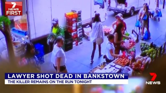 CCTV footage from a nearby shop shows a man, dressed in a hi-visibility vest and a hat, who police want to speak to in relation to the shooting.