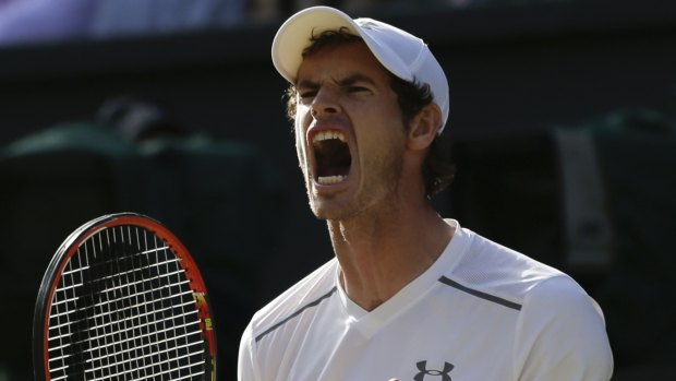 Overpowered ... Andy Murray celebrates winning a point against Roger Federer in their semi-final.