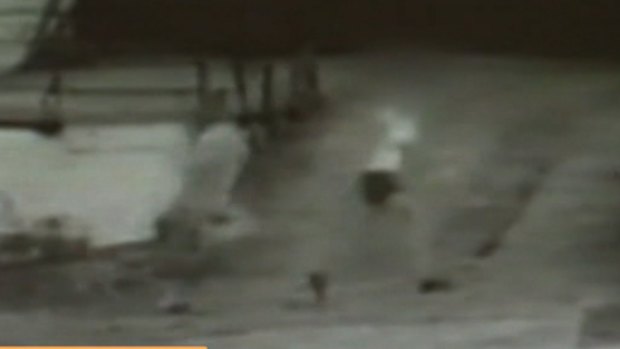 The grainy CCTV vision showed the woman running from the attack. 