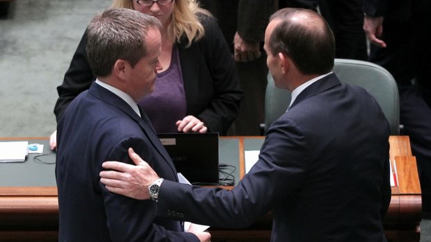 Bill Shorten and Tony Abbott in discussion after delivering statements on Malaysian Airlines flight MH17: No time for partisanship. 