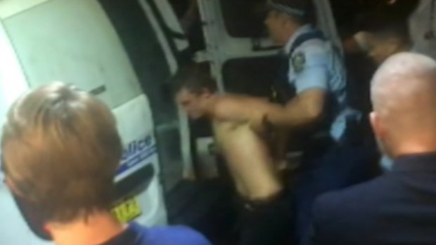 Police arrest a man following a brawl in Potts Point on Sunday night.