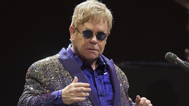 Elton John is being sued by his ex-bodyguard for "sexual harassment".