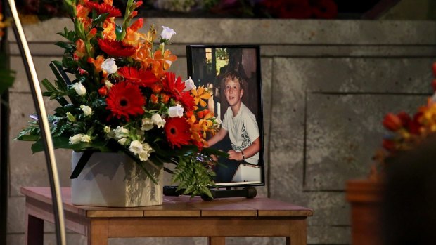 A photo of Edison Hellmuth, 11, by the podium at his funeral service.