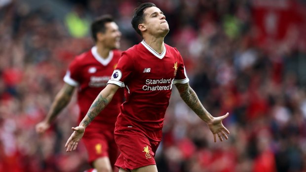Philippe Coutinho celebrates finding the net for Liverpool.