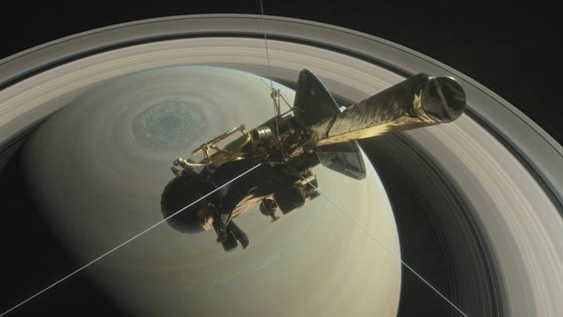 An artist's rendering shows NASA's Cassini spacecraft above Saturn's northern hemisphere, heading toward its first dive between Saturn and its rings on Thursday.