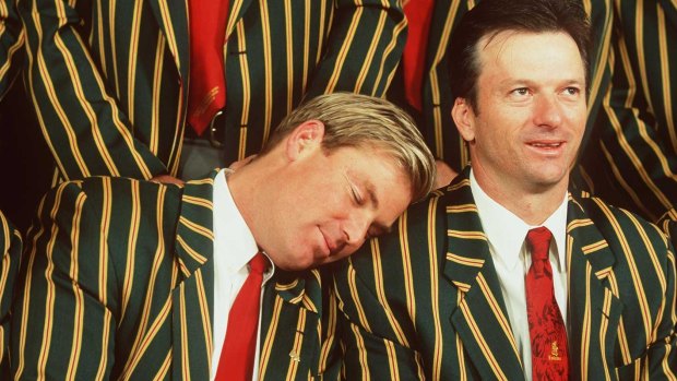 Shane Warne takes a snooze on the shoulder of teammate Steve Waugh in 1999.