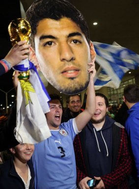 Fans await for the arrival of Uruguay's striker Luis Suarez.