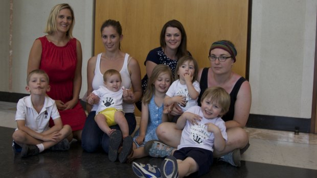 Greens Senate candidates Christina Hobbs and Carly Saeedi with Senator Sarah Hanson-Young, Aileen Tong and children Zak, Anya, Rose, Sylie, and Leo involved in the sit-in at Parliament House protesting the treatment of asylum seeker baby Asha.