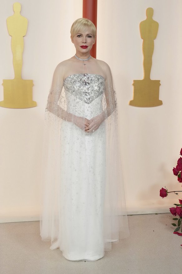 Michelle Williams wears Chanel couture.