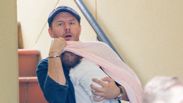 Manu Feildel with new daughter in Double Bay this week. 