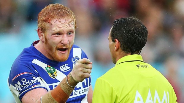 Facing charges: James Graham of the Bulldogs confronts referee Gerard Sutton after he awarded the Rabbitohs the game-winning penalty.