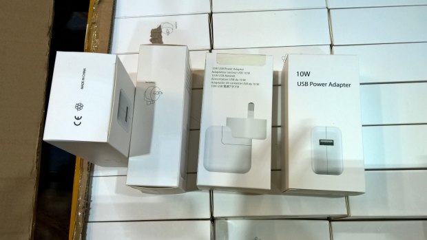 Some of the seized charger packaging, which was styled on branded products.