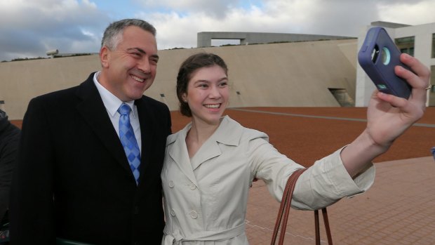 Treasurer Joe Hockey poses for a selfie with Anika Buining during a morning doorstop at Parliament.