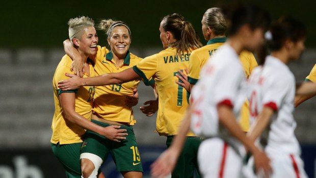 Michelle Heyman celebrates with Australian teammates.