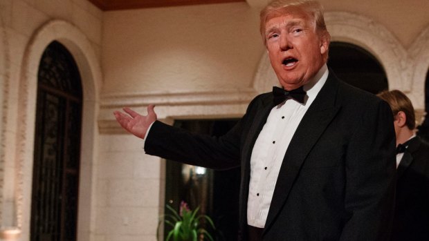 US President Donald Trump arrives for a New Year's Eve gala at his Mar-a-Lago resort in Palm Beach, Florida.