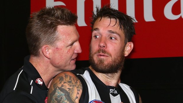 Handy player: Nathan Buckley with Dane Swan.