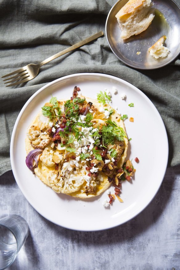 Spiced cauliflower and feta omelette with chorizo and almond dressing.