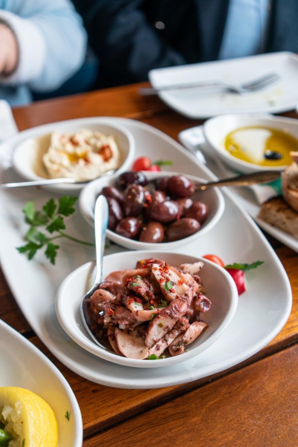 Marinated olives and octopus as part of a Greek feast at Mythos in Oakleigh.