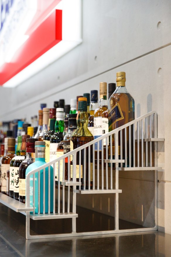 The bar's only actual bleachers are in miniature form, purpose-built to hold their large spirits selection.