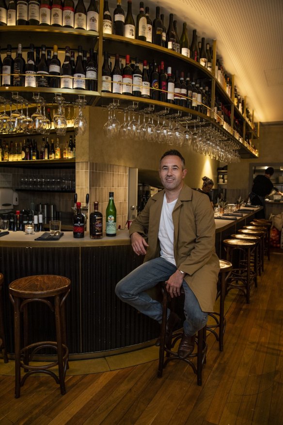 Ragazzi co-owner Nathanial Hatwell with a few of his favourite amaro bottles on the bar.