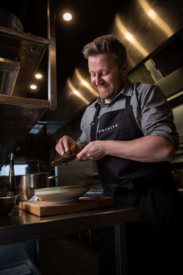 Montalto chef Matt Wilkinson shaves new season Red Hill truffles on polenta.