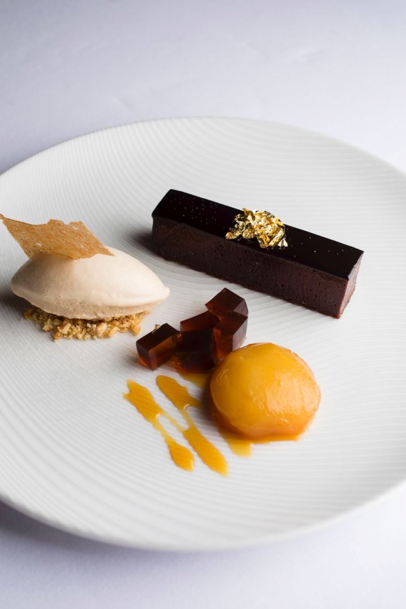 A signature dish as est.: Valrhona chocolate torte, Pedro Ximenez jelly, caramel poached pear and hazelnut praline ice-cream.