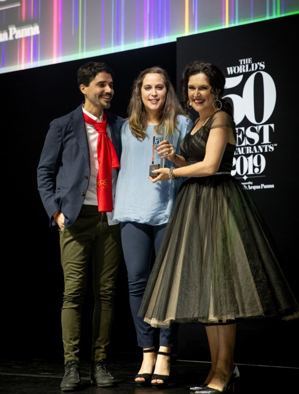 Host Annabel Crabb (right) presents Virgilio Martinez and Pia Leon from Central in Peru, with the award for Best Restaurant in South America.
