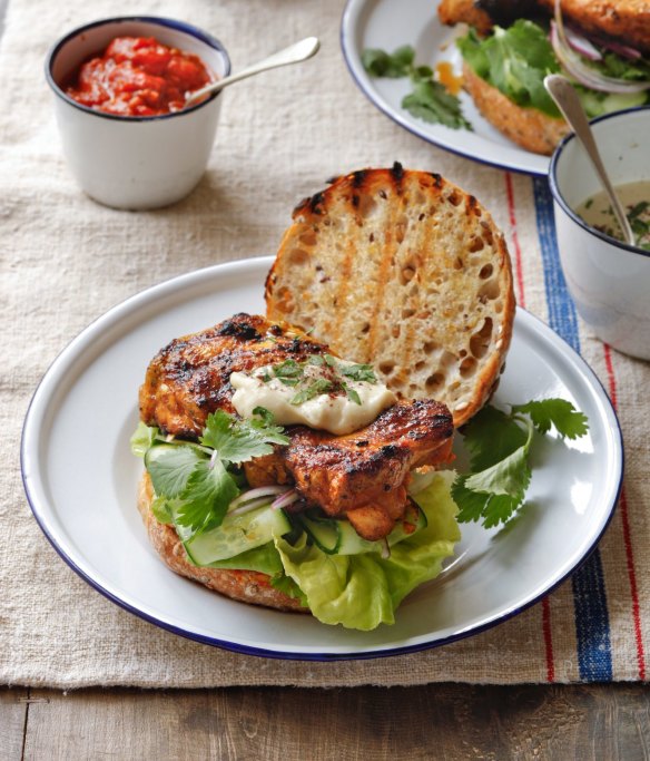Bill Granger's grilled chicken thigh burgers with tahini and chilli relish.