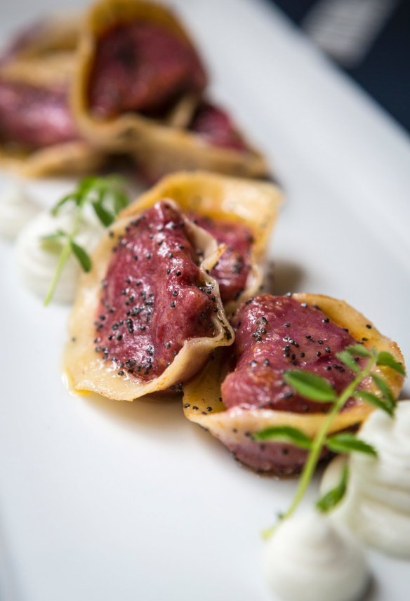 Poppyseed sprinkled beetroot ravioli.