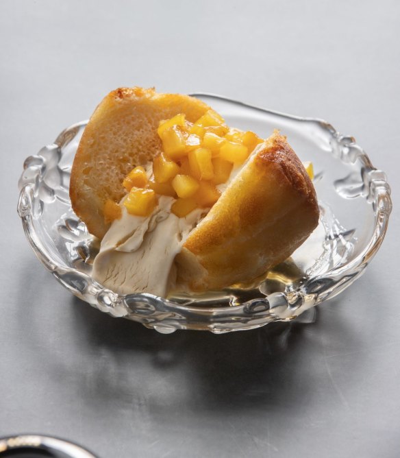 Rum baba with diced pineapple.