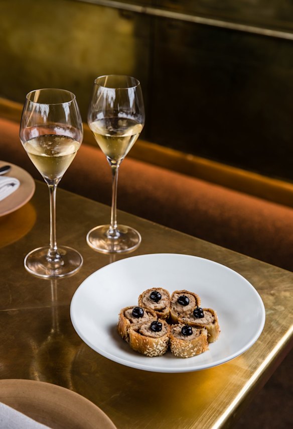 Champagne and sausage rolls at Bennelong.