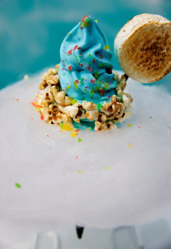 Sea salt soft-serve topped with toasted marshmallow, popping candy, popcorn and surrounded by fairy floss at Aqua S.