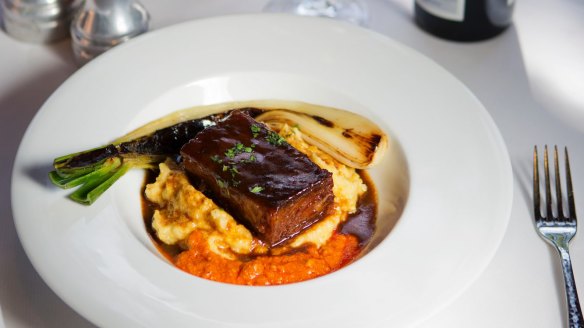 Red wine-braised beef short rib, Anson Mills polenta and roasted torpedo onion at A.R. Valentien, San Diego.