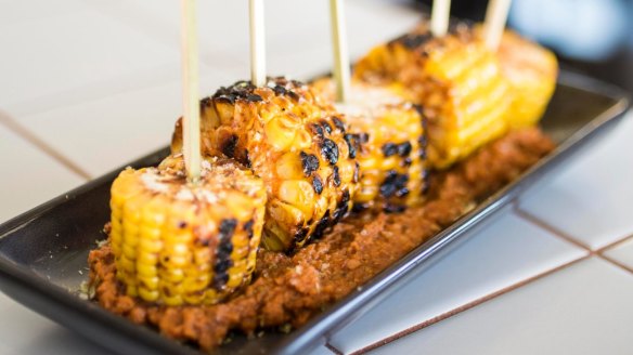 Corn on the cob with chipotle sauce.