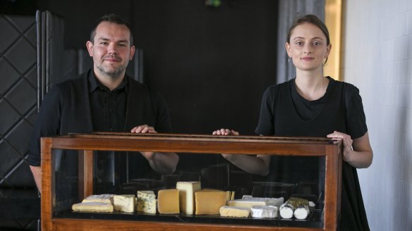 Renato Pagliardi and Bronte Millington display Vue de Monde's all-Australian cheese trolley. 
