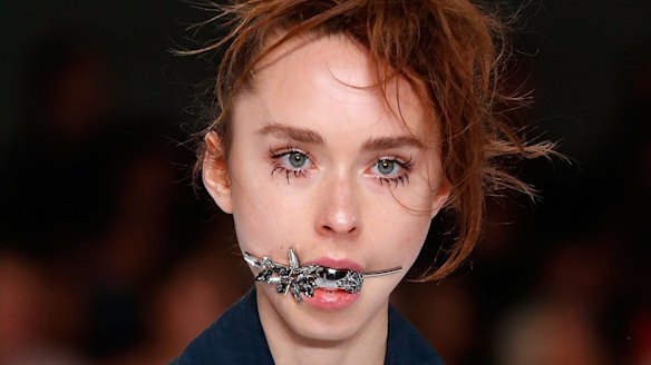 Odd-ball jewellery: A model walks the runway for Toni Maticevski's Resort17 Collections.