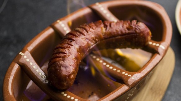 The flaming chorizo is soaked in sherry.