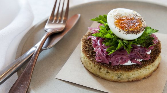 Falafel crumpet with tahini, pickled onion and soft-boiled egg at Nour. 
