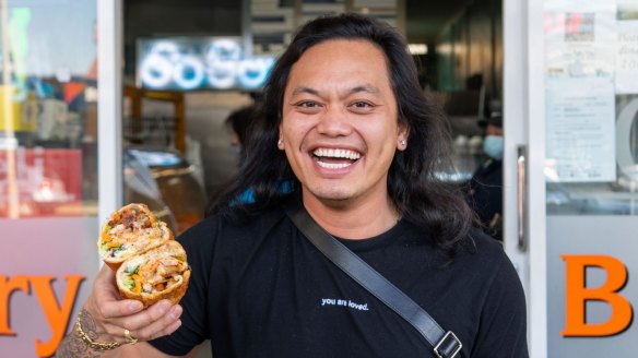 Khanh Ong with a banh mi from Tabac Bakery in Springvale.