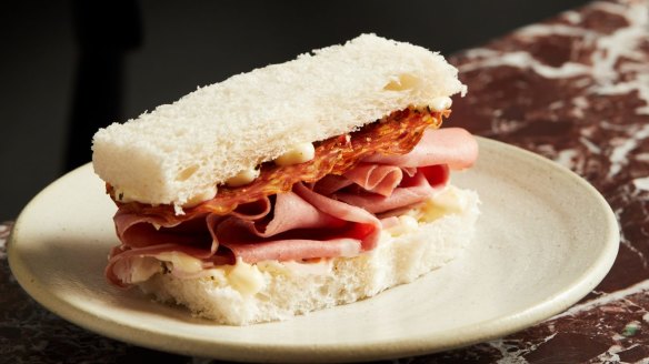 Fugazzi's signature mortadella and salami finger sando with mayo, pickled shallot and pecorino. 