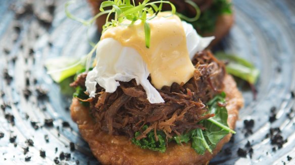 Bluestone Benedict: Roti piled with braised beef cheek, kale, poached egg and hollandaise.